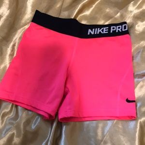 Neon pink nike pro’s